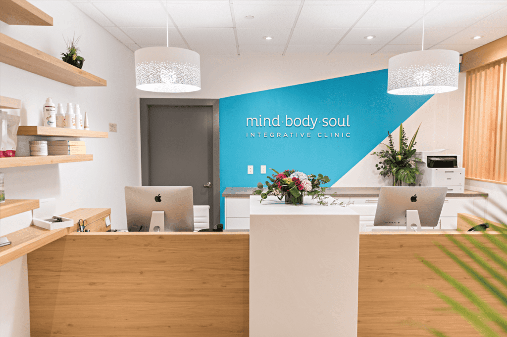 Mind Body Soul Integrative Clinic Sign in brightly lit office; highlighting the open house event
