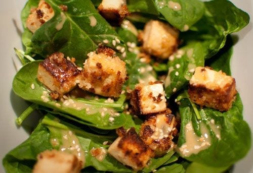 Closeup of the Crispy Panko Tofu Salad on Baby Spinach with Glory Bowl Dressing