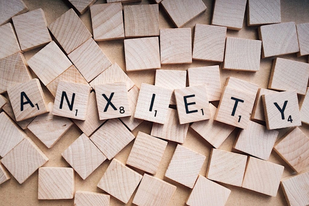 Scrabble pieces spelling out the word anxiety, highlighting the topic of this piece, managing anxiety